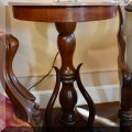 F12. Round mahogany side table with duck head feet. 25.5"h 